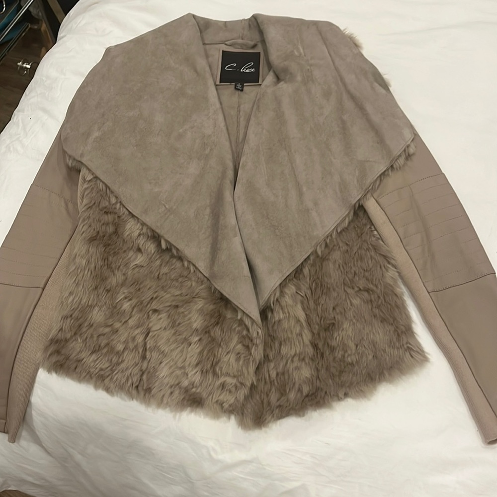 Faux fur and leather jacket. Never been worn.